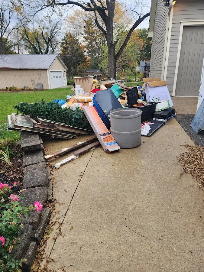 Dumpster being loaded with debris for Commercial Dumpster Rental in Park Ridge